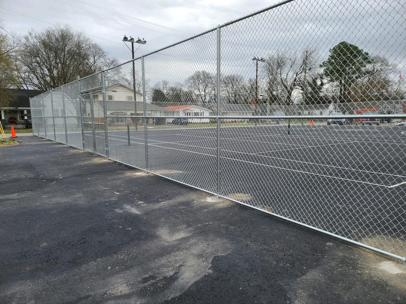Galvanized chain-link fence installation